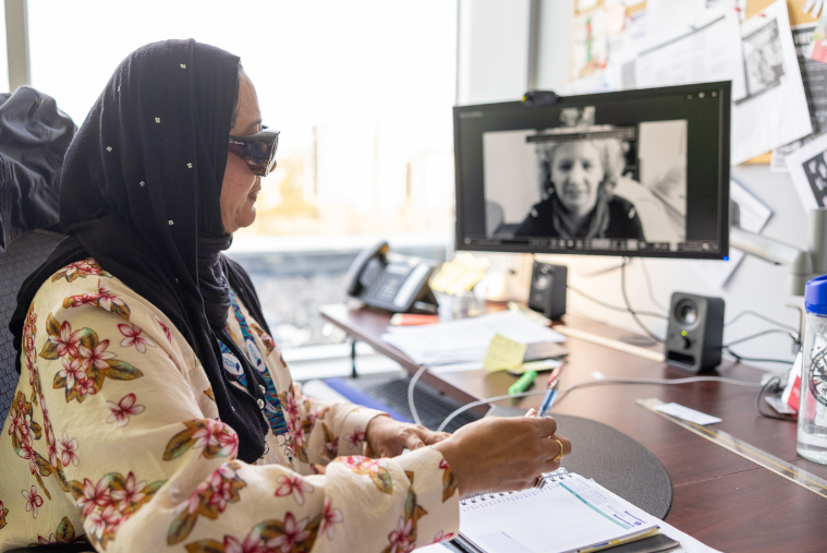 woman at desk on a virtual call
