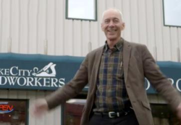 Chris Fyles, Executive Director of Lake City Woodworkers, in front of the shop