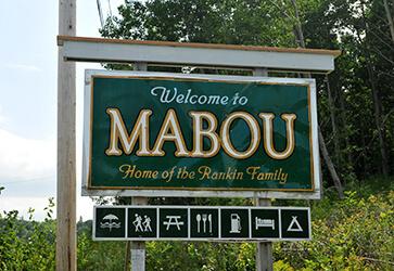 Green outdoor ‘Welcome to Mabou’ sign